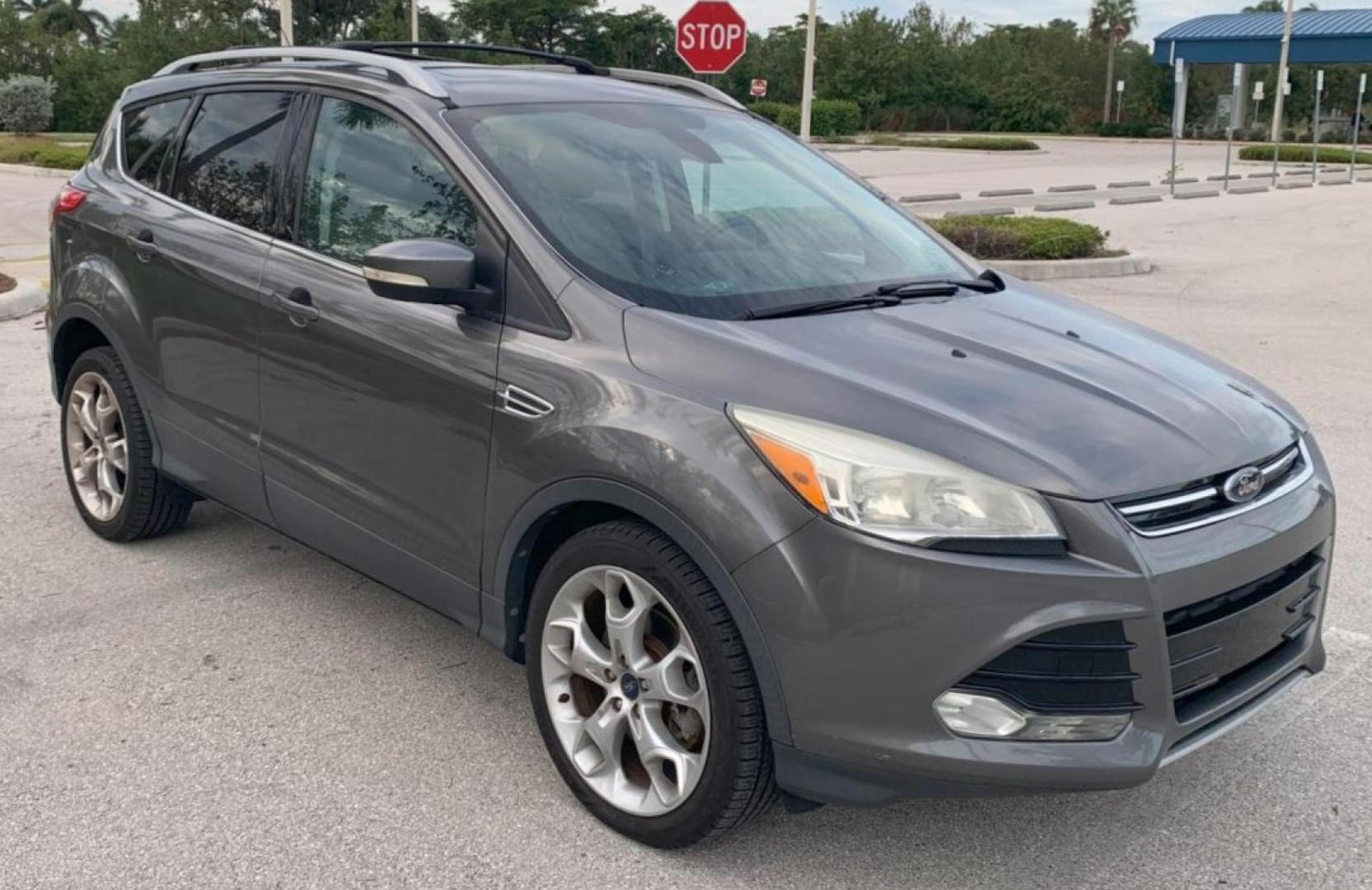 2014 GREY /Medium Light Stone FORD ESCAPE TITANIUM (1FMCU9J95EU) with an 2.0L engine, Automatic transmission, located at 11170 Summerlin Square Dr., Fort Myers Beach, FL, 33931, (239) 999-7777, 26.493546, -81.941628 - 37 Service History Records Carfax - Photo#2