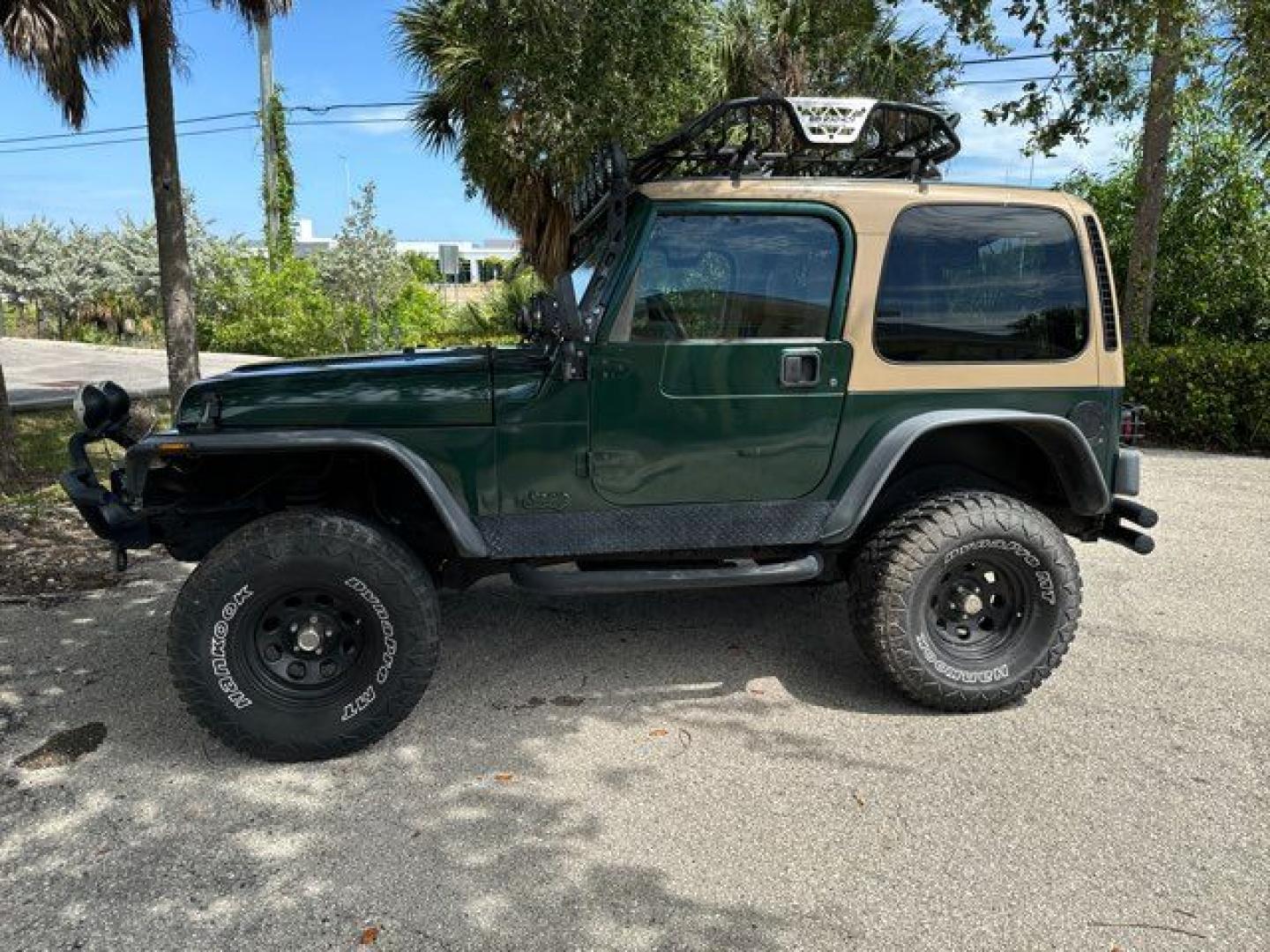 1999 Forest Green Pearlcoat /Agate Vinyl Jeep Wrangler Sport (1J4FY19S5XP) with an 4.0L L6 OHV 12V engine, located at 11170 Summerlin Square Dr., Fort Myers Beach, FL, 33931, (239) 999-7777, 26.493546, -81.941628 - Photo#1
