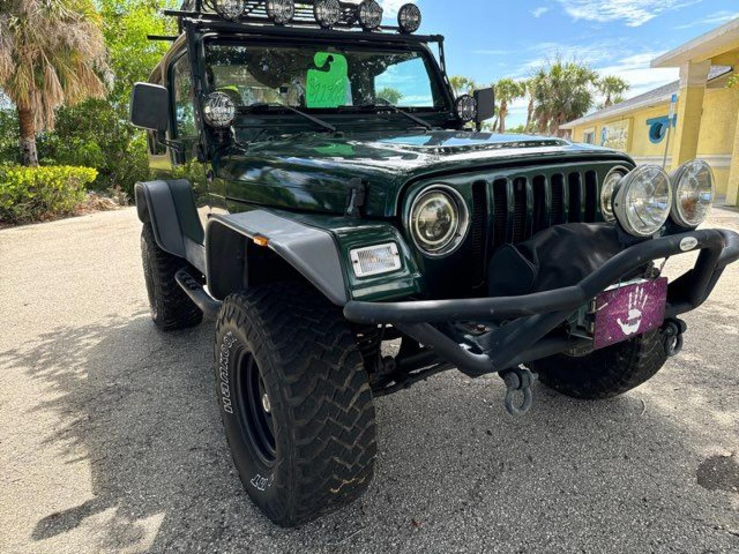 1999 Forest Green Pearlcoat /Agate Vinyl Jeep Wrangler Sport (1J4FY19S5XP) with an 4.0L L6 OHV 12V engine, located at 11170 Summerlin Square Dr., Fort Myers Beach, FL, 33931, (239) 999-7777, 26.493546, -81.941628 - Photo#3
