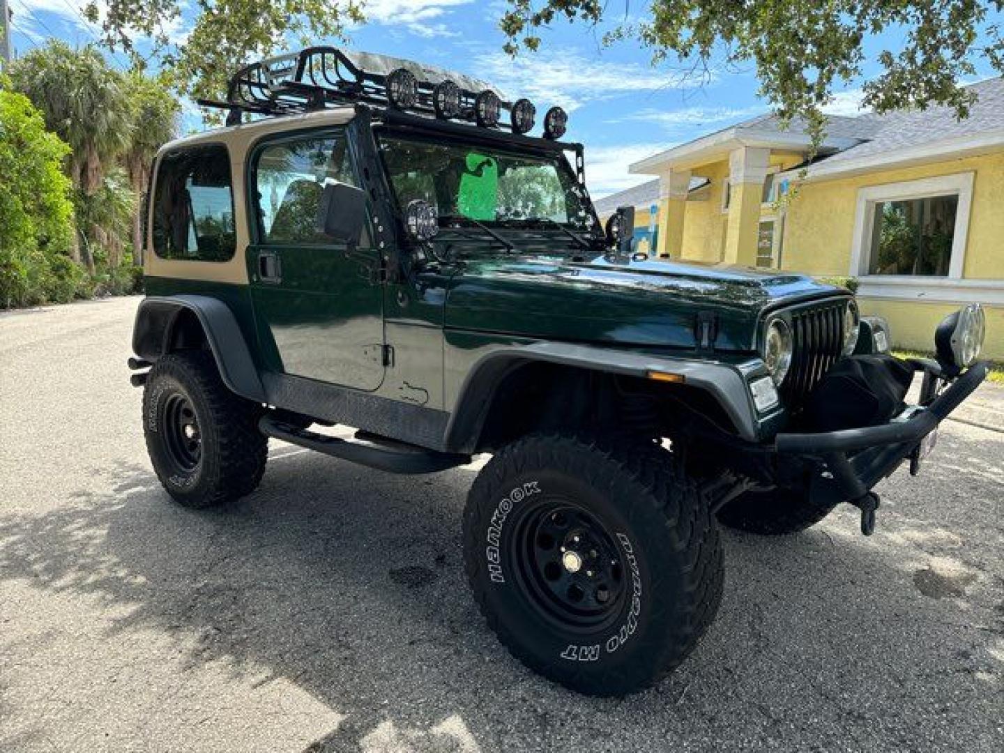 1999 Forest Green Pearlcoat /Agate Vinyl Jeep Wrangler Sport (1J4FY19S5XP) with an 4.0L L6 OHV 12V engine, located at 11170 Summerlin Square Dr., Fort Myers Beach, FL, 33931, (239) 999-7777, 26.493546, -81.941628 - Photo#5