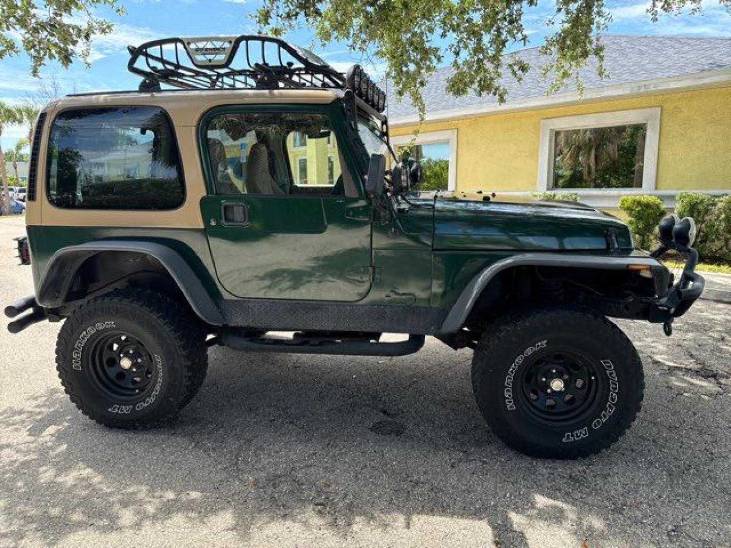 1999 Forest Green Pearlcoat /Agate Vinyl Jeep Wrangler Sport (1J4FY19S5XP) with an 4.0L L6 OHV 12V engine, located at 11170 Summerlin Square Dr., Fort Myers Beach, FL, 33931, (239) 999-7777, 26.493546, -81.941628 - Photo#6