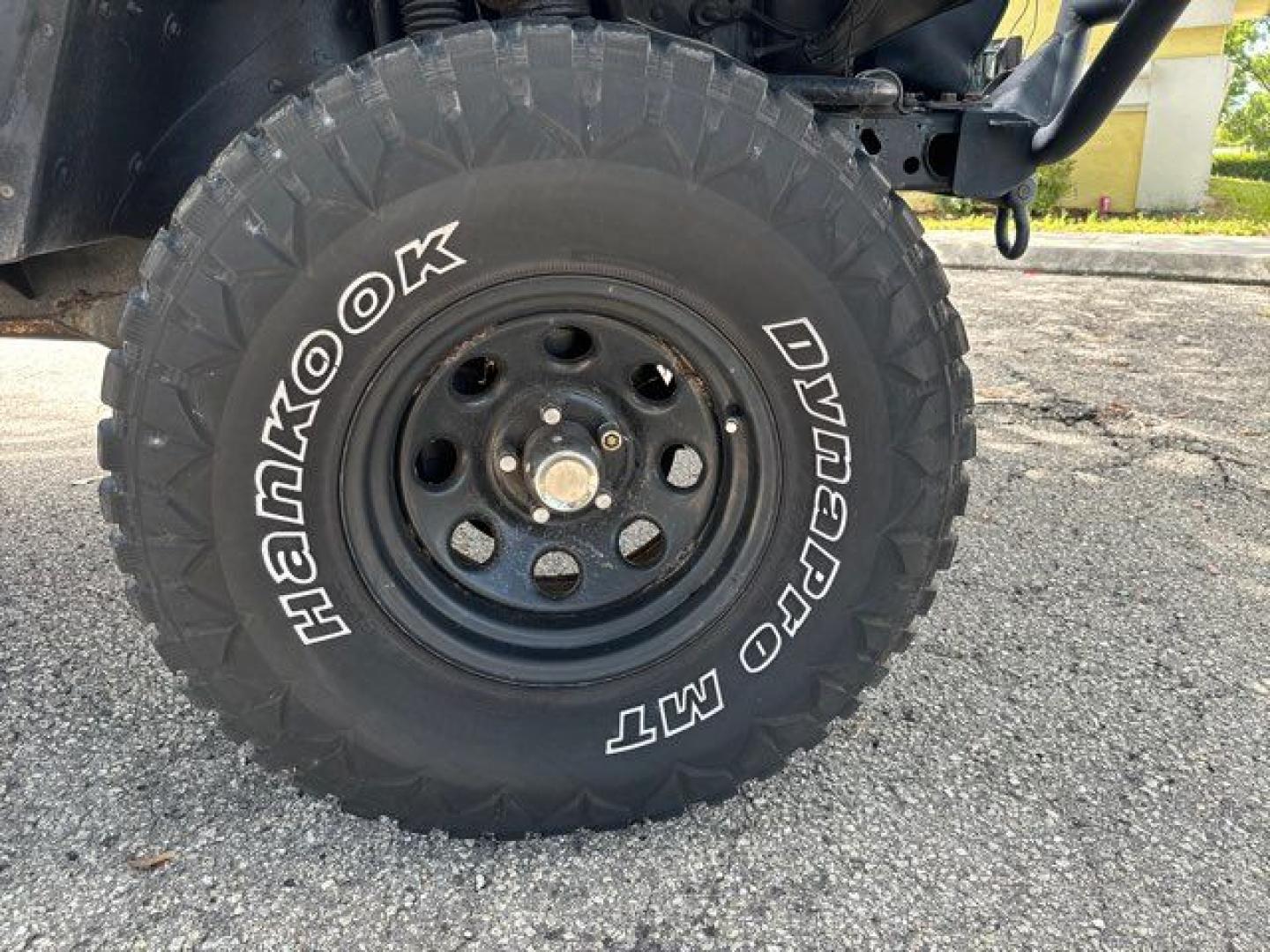 1999 Forest Green Pearlcoat /Agate Vinyl Jeep Wrangler Sport (1J4FY19S5XP) with an 4.0L L6 OHV 12V engine, located at 11170 Summerlin Square Dr., Fort Myers Beach, FL, 33931, (239) 999-7777, 26.493546, -81.941628 - Photo#7