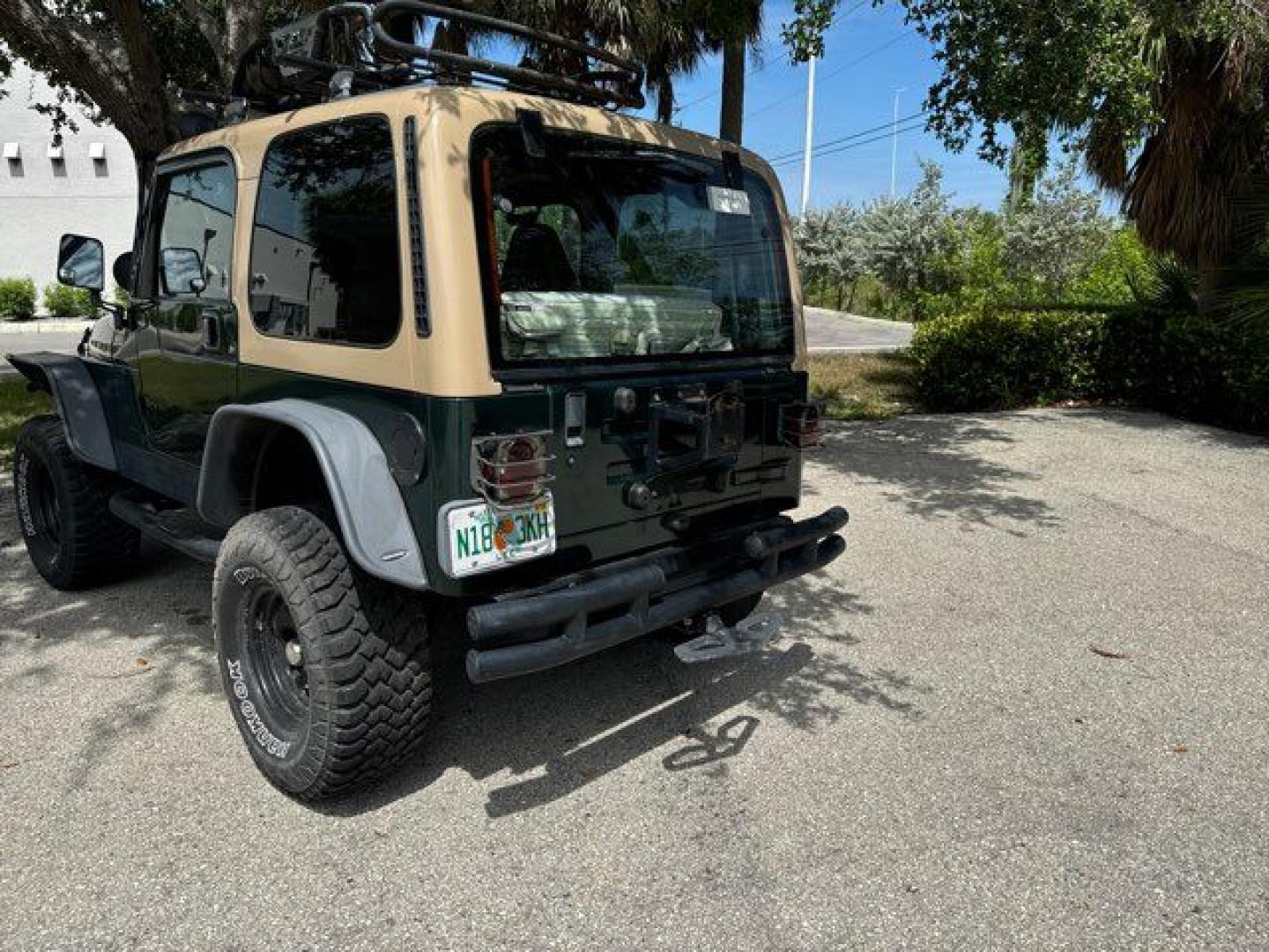 1999 Forest Green Pearlcoat /Agate Vinyl Jeep Wrangler Sport (1J4FY19S5XP) with an 4.0L L6 OHV 12V engine, located at 11170 Summerlin Square Dr., Fort Myers Beach, FL, 33931, (239) 999-7777, 26.493546, -81.941628 - Photo#10
