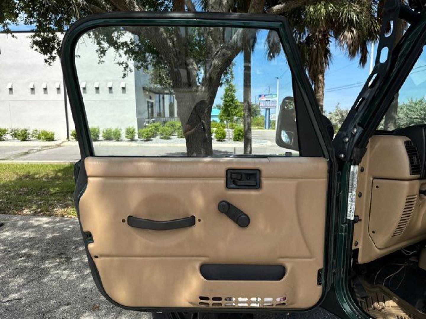 1999 Forest Green Pearlcoat /Agate Vinyl Jeep Wrangler Sport (1J4FY19S5XP) with an 4.0L L6 OHV 12V engine, located at 11170 Summerlin Square Dr., Fort Myers Beach, FL, 33931, (239) 999-7777, 26.493546, -81.941628 - Photo#11