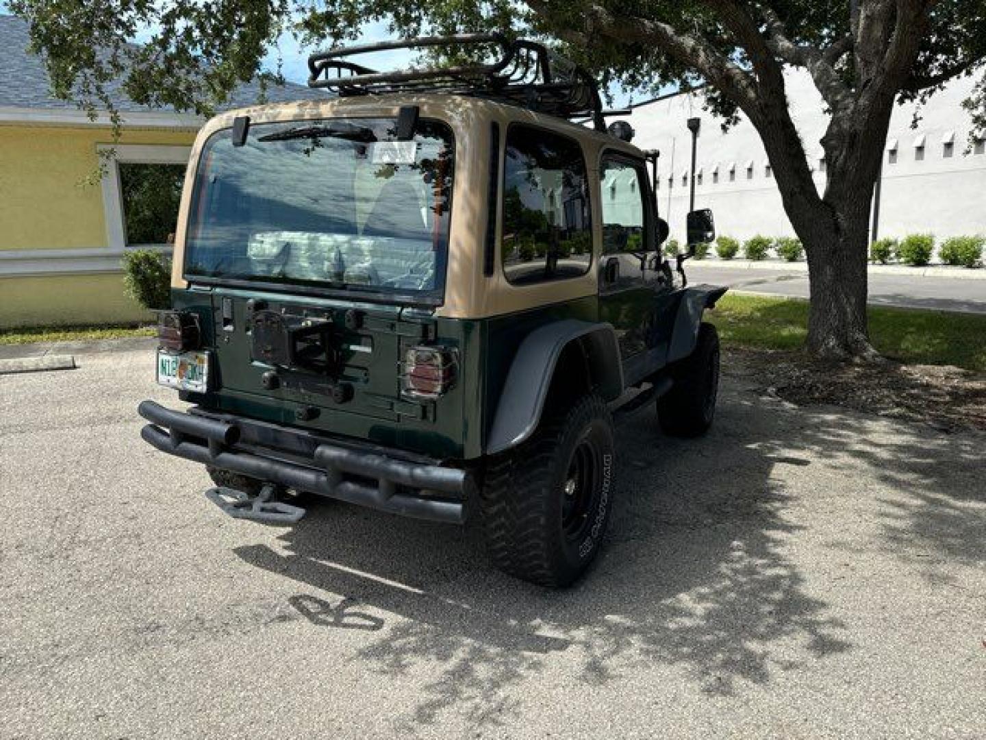 1999 Forest Green Pearlcoat /Agate Vinyl Jeep Wrangler Sport (1J4FY19S5XP) with an 4.0L L6 OHV 12V engine, located at 11170 Summerlin Square Dr., Fort Myers Beach, FL, 33931, (239) 999-7777, 26.493546, -81.941628 - Photo#12