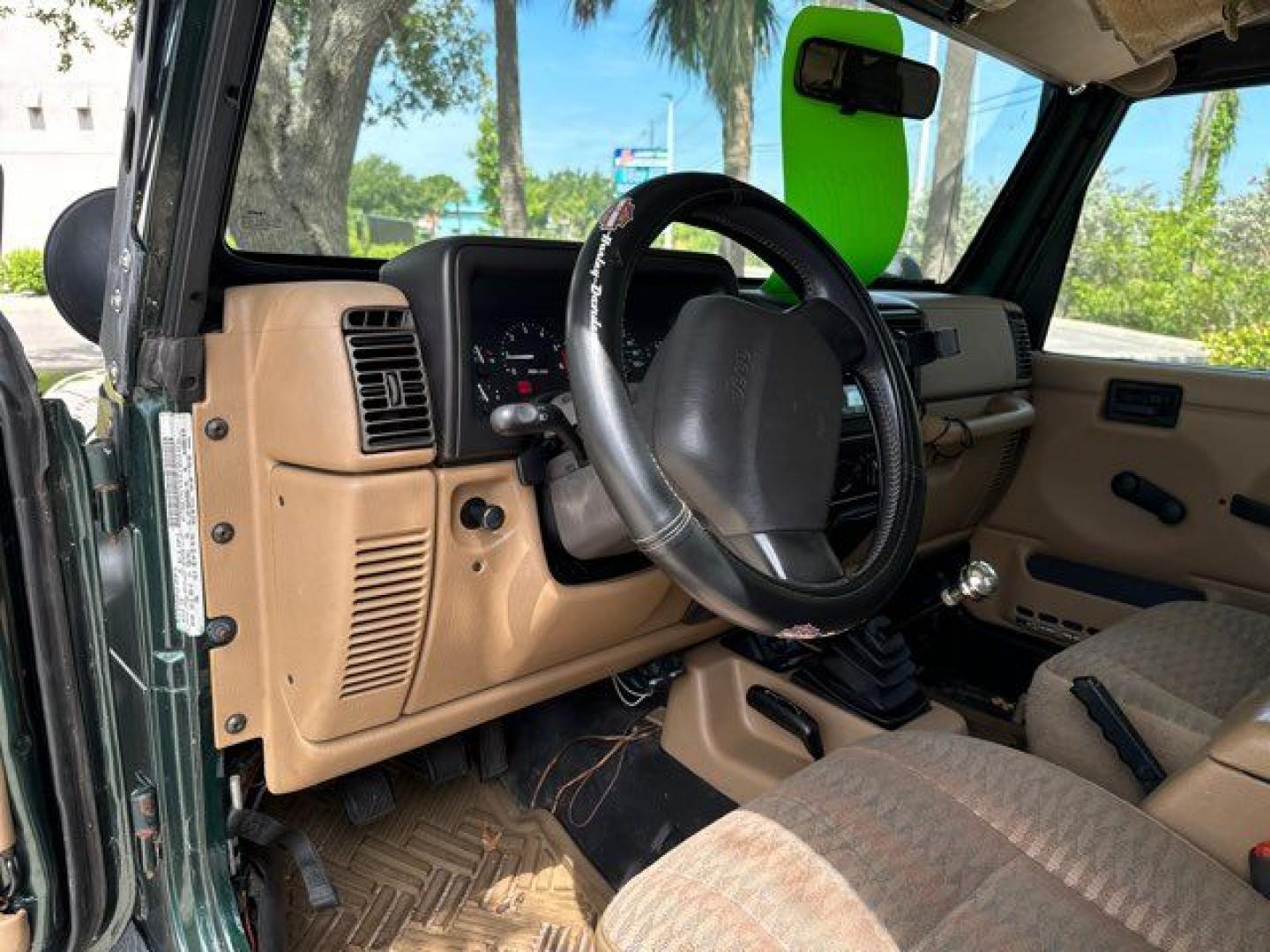 1999 Forest Green Pearlcoat /Agate Vinyl Jeep Wrangler Sport (1J4FY19S5XP) with an 4.0L L6 OHV 12V engine, located at 11170 Summerlin Square Dr., Fort Myers Beach, FL, 33931, (239) 999-7777, 26.493546, -81.941628 - Photo#14