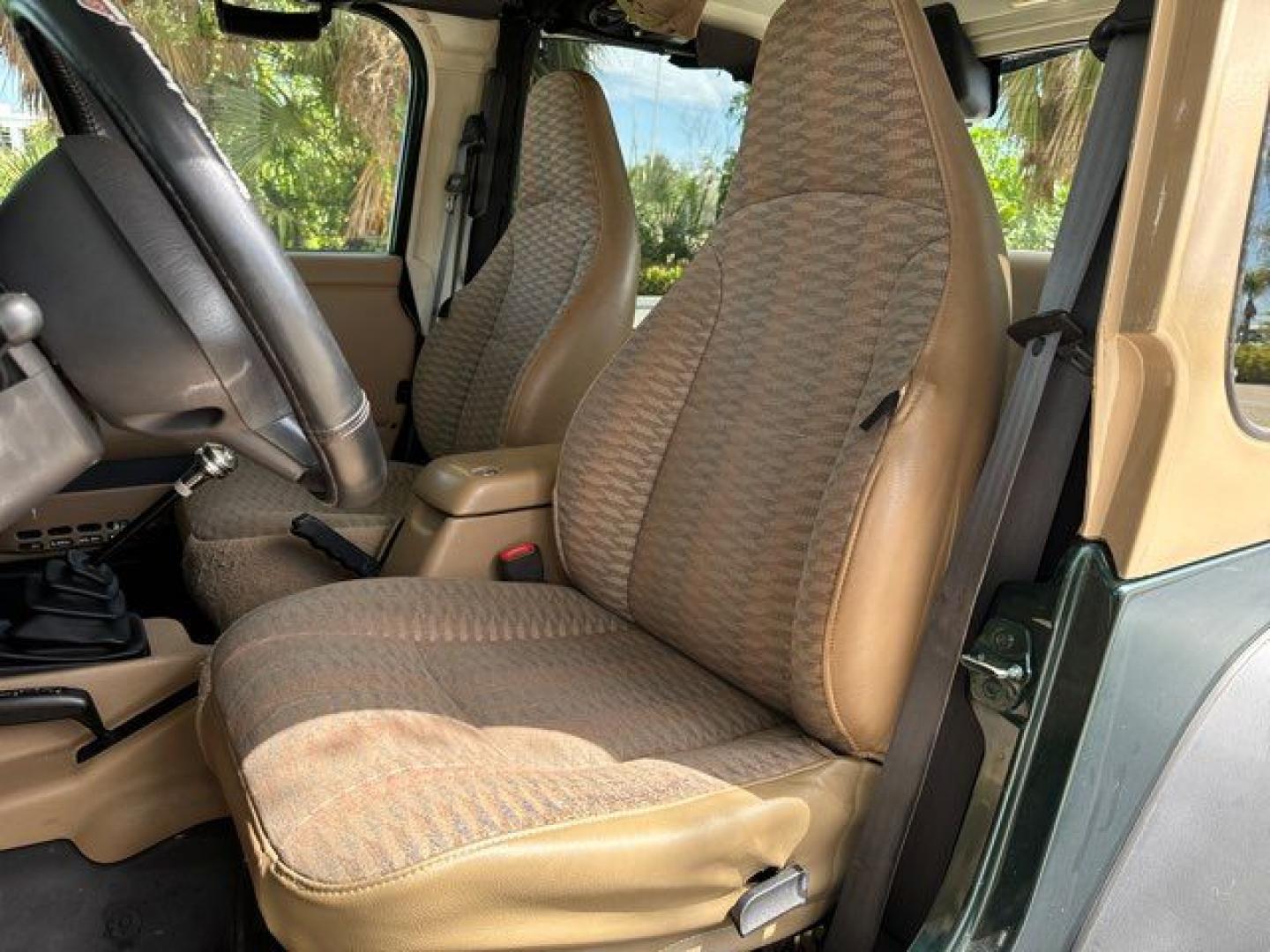 1999 Forest Green Pearlcoat /Agate Vinyl Jeep Wrangler Sport (1J4FY19S5XP) with an 4.0L L6 OHV 12V engine, located at 11170 Summerlin Square Dr., Fort Myers Beach, FL, 33931, (239) 999-7777, 26.493546, -81.941628 - Photo#16