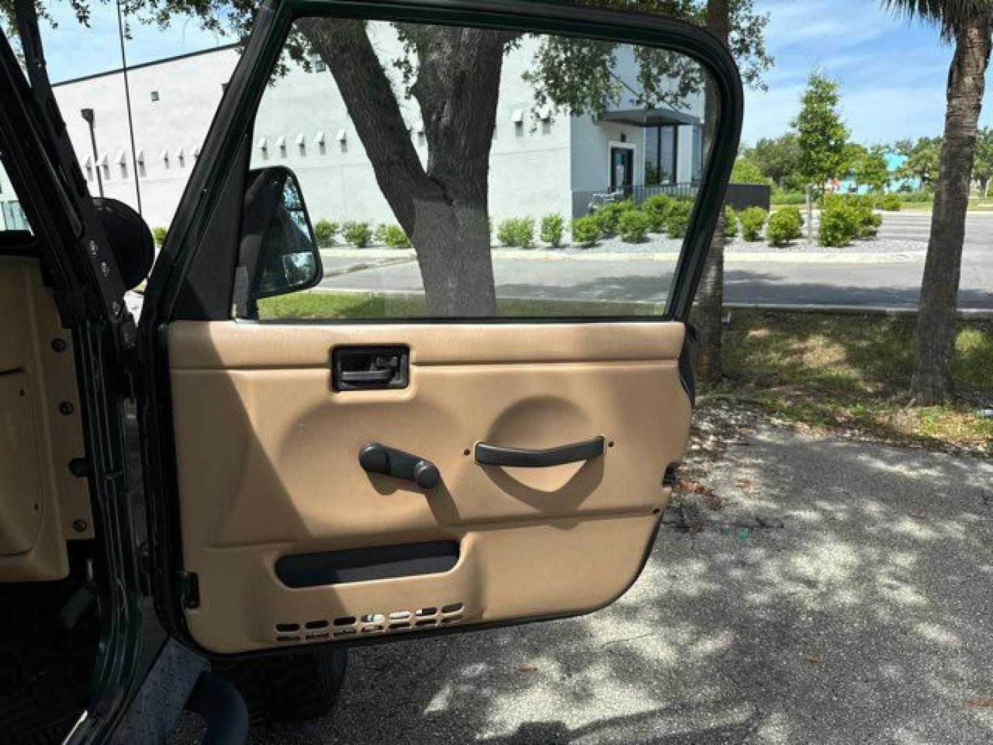 1999 Forest Green Pearlcoat /Agate Vinyl Jeep Wrangler Sport (1J4FY19S5XP) with an 4.0L L6 OHV 12V engine, located at 11170 Summerlin Square Dr., Fort Myers Beach, FL, 33931, (239) 999-7777, 26.493546, -81.941628 - Photo#17