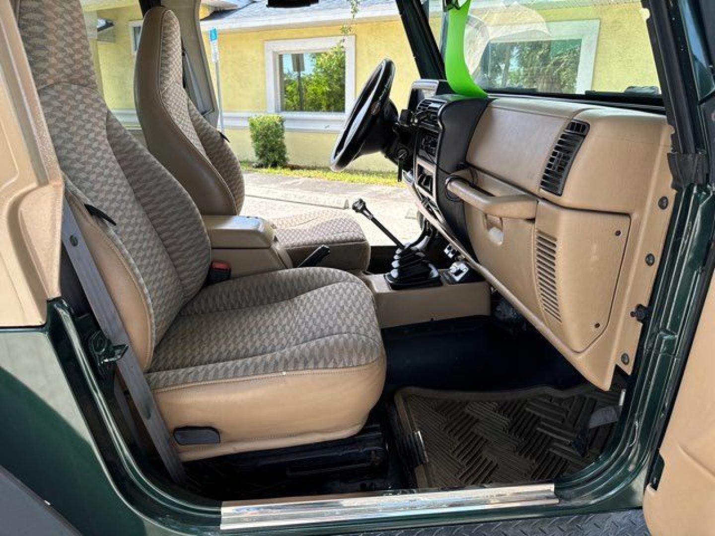 1999 Forest Green Pearlcoat /Agate Vinyl Jeep Wrangler Sport (1J4FY19S5XP) with an 4.0L L6 OHV 12V engine, located at 11170 Summerlin Square Dr., Fort Myers Beach, FL, 33931, (239) 999-7777, 26.493546, -81.941628 - Photo#18