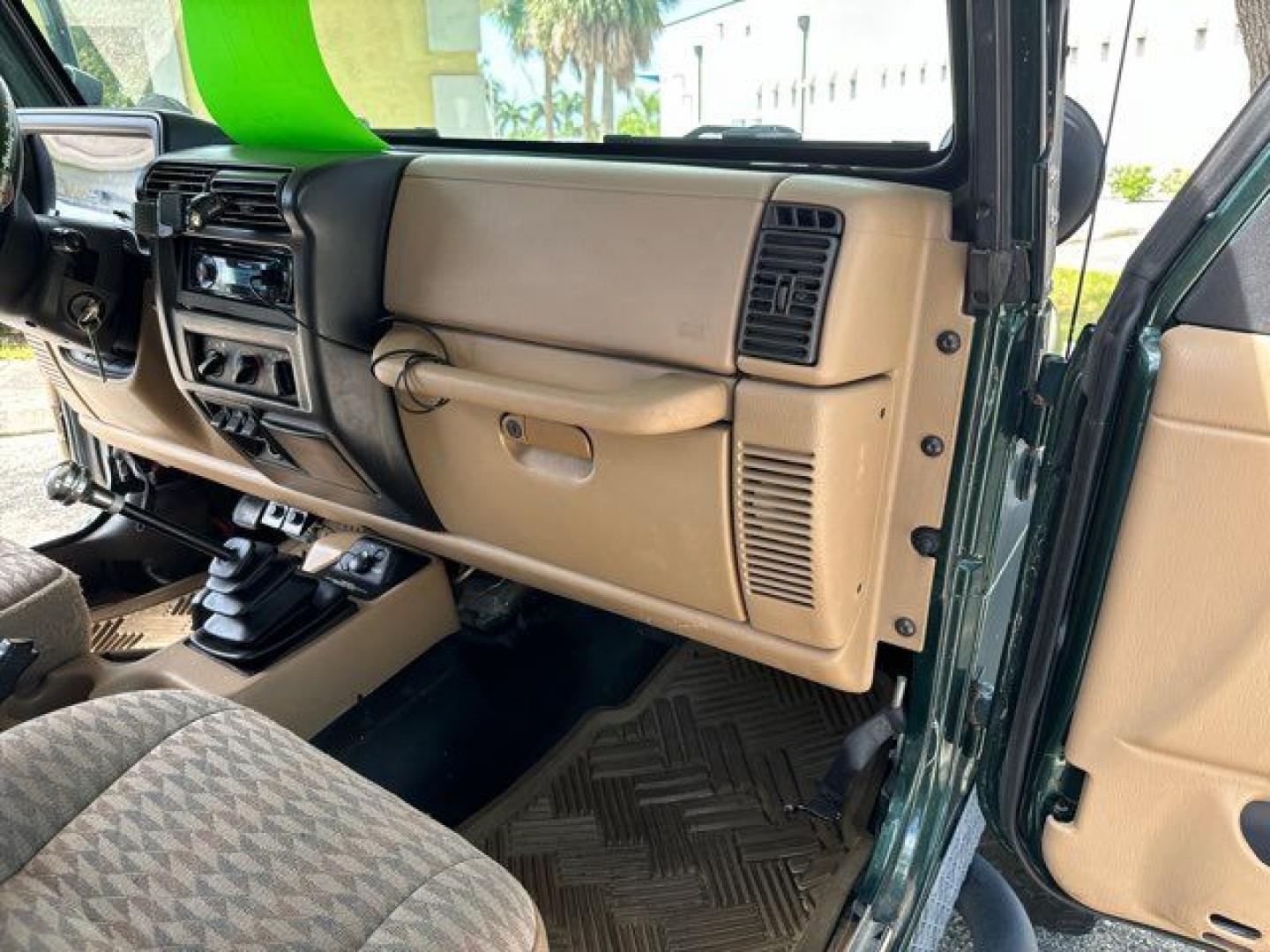 1999 Forest Green Pearlcoat /Agate Vinyl Jeep Wrangler Sport (1J4FY19S5XP) with an 4.0L L6 OHV 12V engine, located at 11170 Summerlin Square Dr., Fort Myers Beach, FL, 33931, (239) 999-7777, 26.493546, -81.941628 - Photo#19
