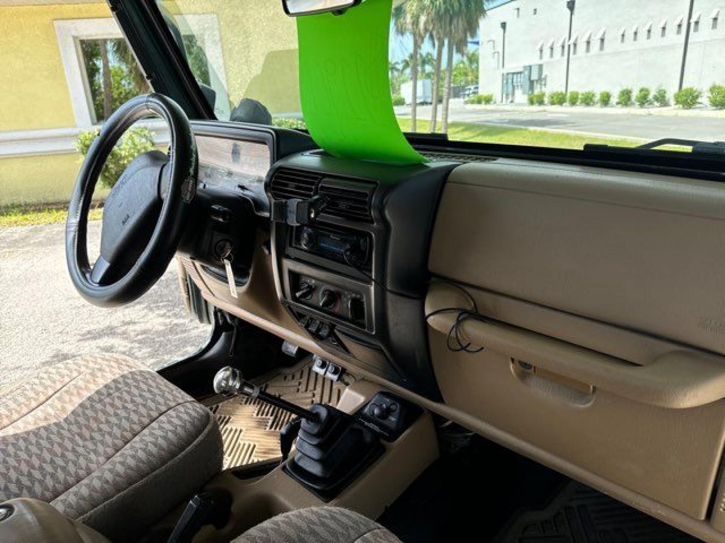 1999 Forest Green Pearlcoat /Agate Vinyl Jeep Wrangler Sport (1J4FY19S5XP) with an 4.0L L6 OHV 12V engine, located at 11170 Summerlin Square Dr., Fort Myers Beach, FL, 33931, (239) 999-7777, 26.493546, -81.941628 - Photo#22