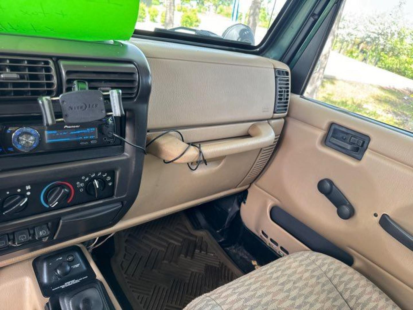 1999 Forest Green Pearlcoat /Agate Vinyl Jeep Wrangler Sport (1J4FY19S5XP) with an 4.0L L6 OHV 12V engine, located at 11170 Summerlin Square Dr., Fort Myers Beach, FL, 33931, (239) 999-7777, 26.493546, -81.941628 - Photo#24