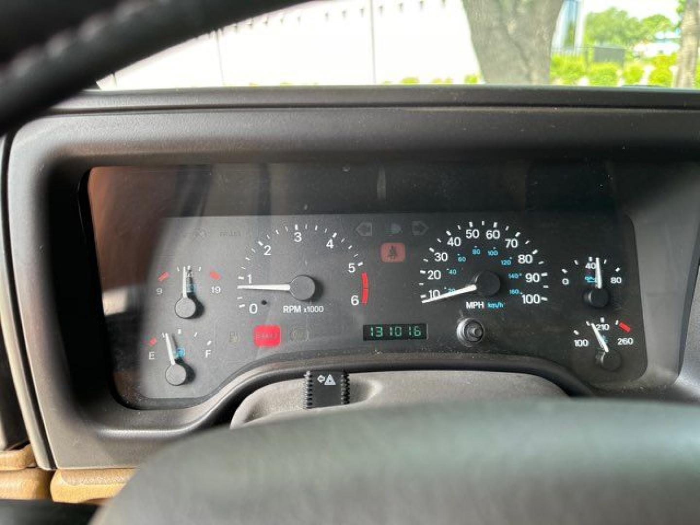 1999 Forest Green Pearlcoat /Agate Vinyl Jeep Wrangler Sport (1J4FY19S5XP) with an 4.0L L6 OHV 12V engine, located at 11170 Summerlin Square Dr., Fort Myers Beach, FL, 33931, (239) 999-7777, 26.493546, -81.941628 - Photo#27