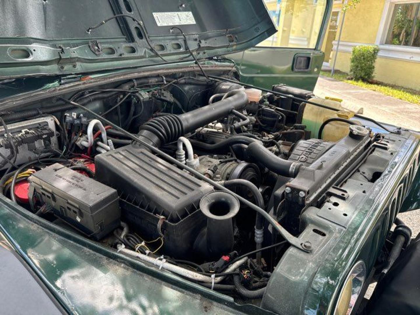 1999 Forest Green Pearlcoat /Agate Vinyl Jeep Wrangler Sport (1J4FY19S5XP) with an 4.0L L6 OHV 12V engine, located at 11170 Summerlin Square Dr., Fort Myers Beach, FL, 33931, (239) 999-7777, 26.493546, -81.941628 - Photo#31