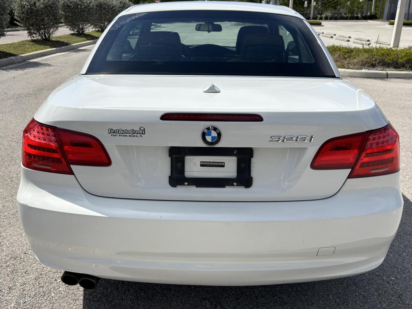 2011 WHITE /BEIGE BMW 328i Convertible Hardtop I SULEV (WBADW7C54BE) with an 3.0L engine, Automatic transmission, located at 11170 Summerlin Square Dr., Fort Myers Beach, FL, 33931, (239) 999-7777, 26.493546, -81.941628 - We have financing available and we accept trades! Fill out a credit application on our website or come by today! If you have any questions, give us a call at (239) 999 - 7777 or visit our website at firstautocredit.com. 11170 Summerlin Square Dr, Fort Myers Beach, FL 33931 - Photo#16