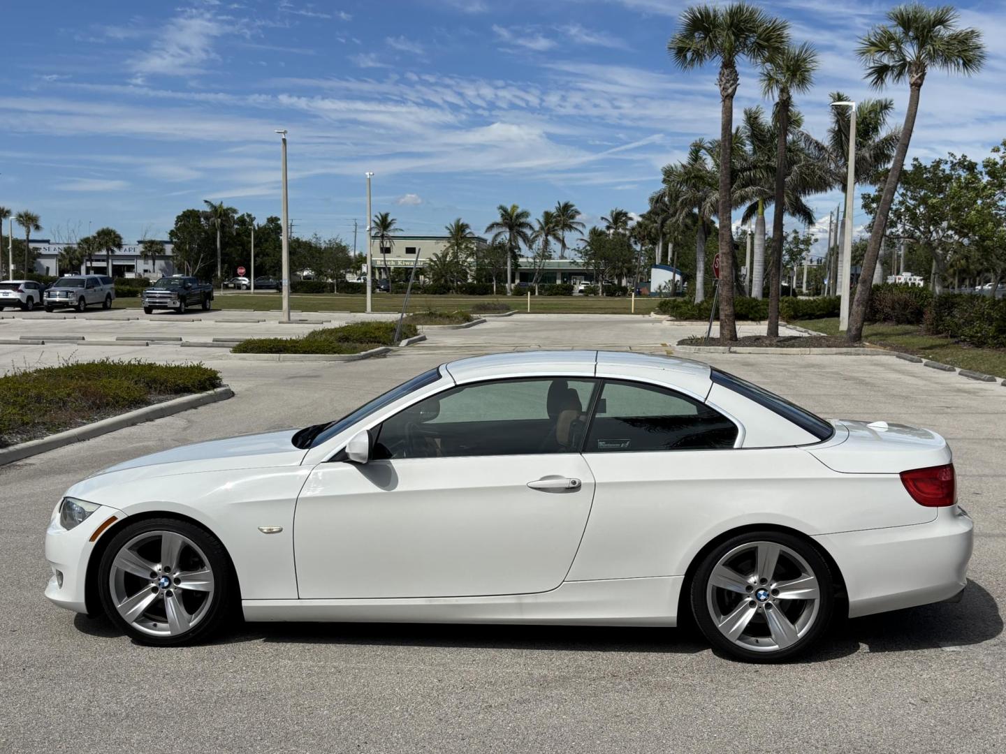 2011 WHITE /BEIGE BMW 328i Convertible Hardtop I SULEV (WBADW7C54BE) with an 3.0L engine, Automatic transmission, located at 11170 Summerlin Square Dr., Fort Myers Beach, FL, 33931, (239) 999-7777, 26.493546, -81.941628 - We have financing available and we accept trades! Fill out a credit application on our website or come by today! If you have any questions, give us a call at (239) 999 - 7777 or visit our website at firstautocredit.com. 11170 Summerlin Square Dr, Fort Myers Beach, FL 33931 - Photo#7