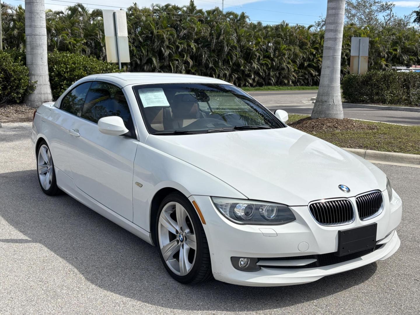 2011 WHITE /BEIGE BMW 328i Convertible Hardtop I SULEV (WBADW7C54BE) with an 3.0L engine, Automatic transmission, located at 11170 Summerlin Square Dr., Fort Myers Beach, FL, 33931, (239) 999-7777, 26.493546, -81.941628 - We have financing available and we accept trades! Fill out a credit application on our website or come by today! If you have any questions, give us a call at (239) 999 - 7777 or visit our website at firstautocredit.com. 11170 Summerlin Square Dr, Fort Myers Beach, FL 33931 - Photo#2