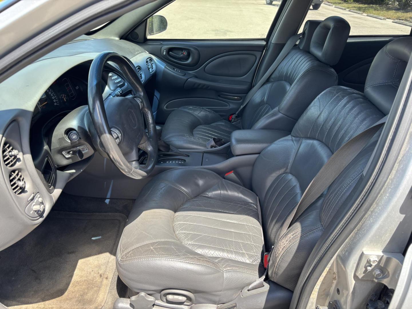 2000 SILVER /GRAY LEATHER Pontiac Bonneville SE (1G2HX54KXY4) with an 3.8L V6 OHV 12V engine, 4-Speed Automatic Overdrive transmission, located at 11170 Summerlin Square Dr., Fort Myers Beach, FL, 33931, (239) 999-7777, 26.493546, -81.941628 - We have financing available and we accept trades! Fill out a credit application on our website or come by today! If you have any questions, give us a call at (239) 999 - 7777 or visit our website at firstautocredit.com. 11170 Summerlin Square Dr, Fort Myers Beach, FL 33931 As Is Due To Veh - Photo#9