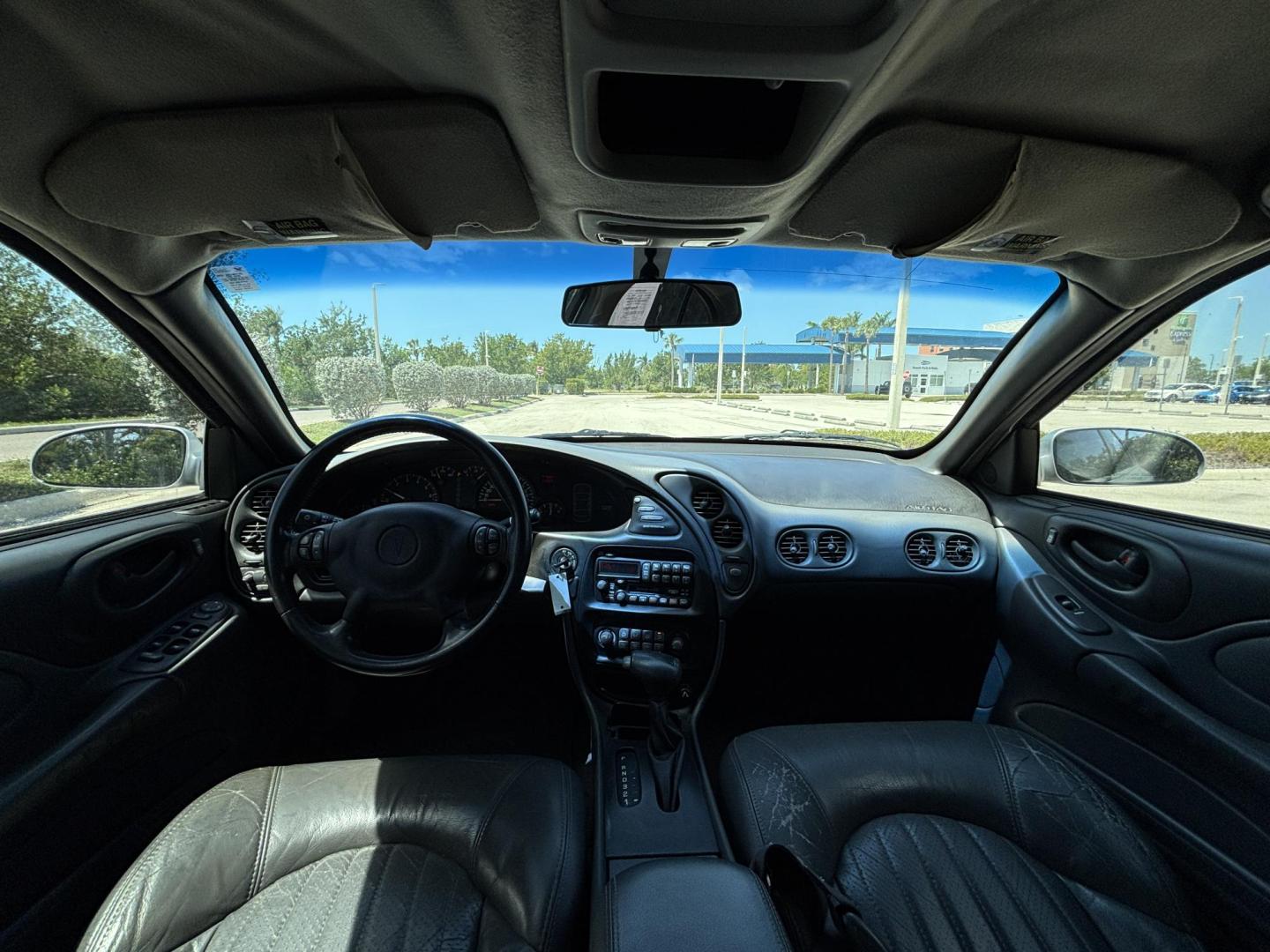 2000 SILVER /GRAY LEATHER Pontiac Bonneville SE (1G2HX54KXY4) with an 3.8L V6 OHV 12V engine, 4-Speed Automatic Overdrive transmission, located at 11170 Summerlin Square Dr., Fort Myers Beach, FL, 33931, (239) 999-7777, 26.493546, -81.941628 - We have financing available and we accept trades! Fill out a credit application on our website or come by today! If you have any questions, give us a call at (239) 999 - 7777 or visit our website at firstautocredit.com. 11170 Summerlin Square Dr, Fort Myers Beach, FL 33931 As Is Due To Veh - Photo#8