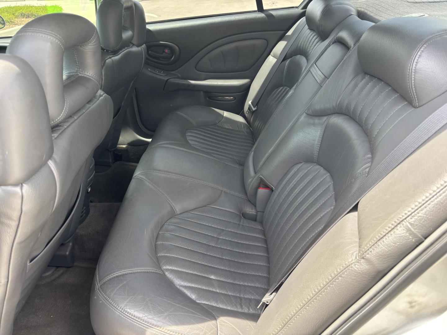 2000 SILVER /GRAY LEATHER Pontiac Bonneville SE (1G2HX54KXY4) with an 3.8L V6 OHV 12V engine, 4-Speed Automatic Overdrive transmission, located at 11170 Summerlin Square Dr., Fort Myers Beach, FL, 33931, (239) 999-7777, 26.493546, -81.941628 - We have financing available and we accept trades! Fill out a credit application on our website or come by today! If you have any questions, give us a call at (239) 999 - 7777 or visit our website at firstautocredit.com. 11170 Summerlin Square Dr, Fort Myers Beach, FL 33931 As Is Due To Veh - Photo#13