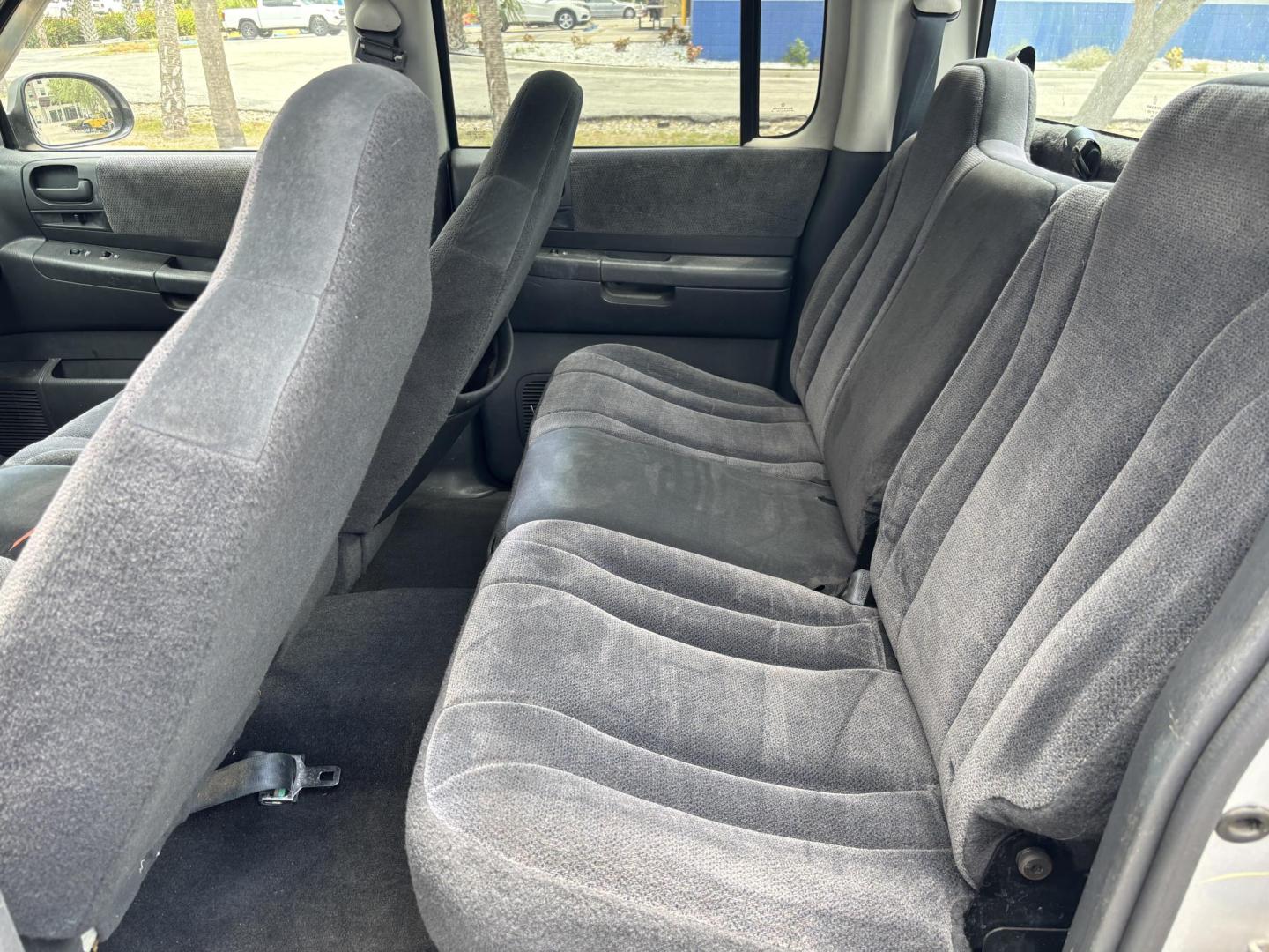 2004 GRAY /GRAY Dodge Dakota SLT Plus Quad Cab 2WD (1D7HL48N54S) with an 4.7L V8 SOHC 16V engine, AUTOMATIC transmission, located at 11170 Summerlin Square Dr., Fort Myers Beach, FL, 33931, (239) 999-7777, 26.493546, -81.941628 - We have financing available and we accept trades! Fill out a credit application on our website or come by today! If you have any questions, give us a call at (239) 999 - 7777 or visit our website at firstautocredit.com. 11170 Summerlin Square Dr, Fort Myers Beach, FL 33931 - Photo#16