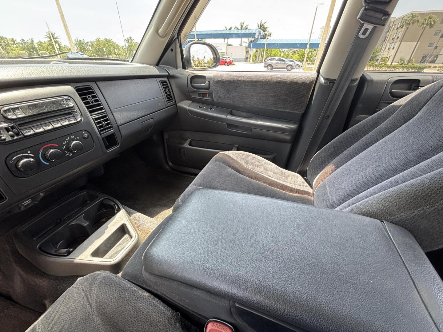 2004 GRAY /GRAY Dodge Dakota SLT Plus Quad Cab 2WD (1D7HL48N54S) with an 4.7L V8 SOHC 16V engine, AUTOMATIC transmission, located at 11170 Summerlin Square Dr., Fort Myers Beach, FL, 33931, (239) 999-7777, 26.493546, -81.941628 - We have financing available and we accept trades! Fill out a credit application on our website or come by today! If you have any questions, give us a call at (239) 999 - 7777 or visit our website at firstautocredit.com. 11170 Summerlin Square Dr, Fort Myers Beach, FL 33931 - Photo#12