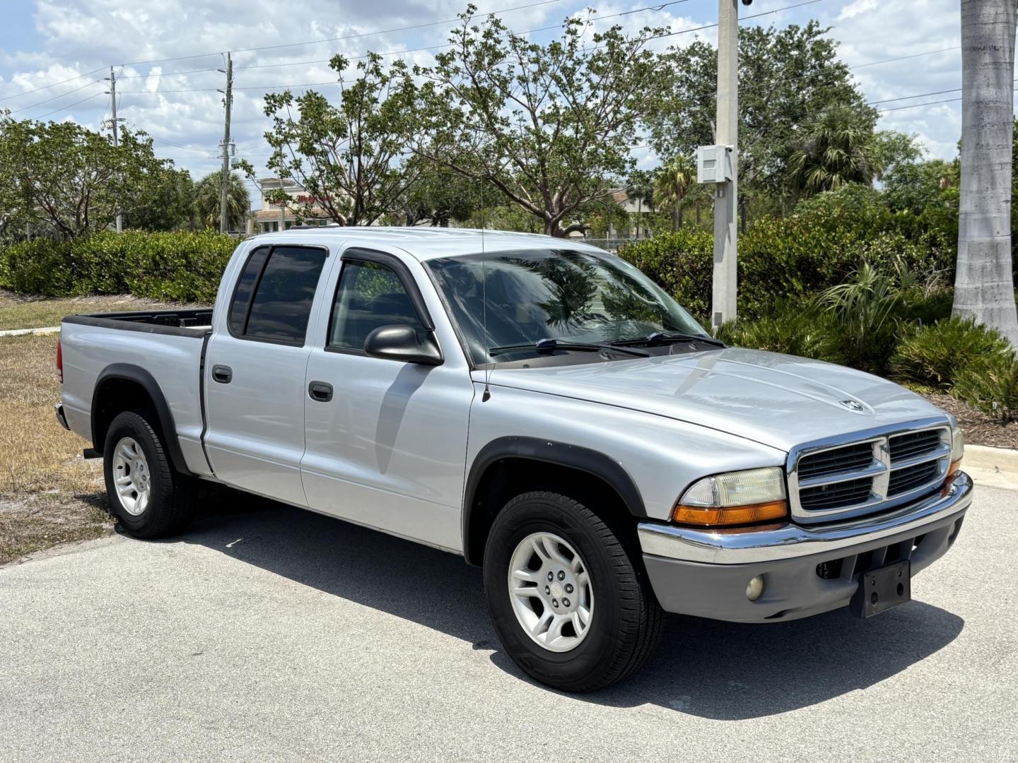 2004 GRAY /GRAY Dodge Dakota SLT Plus Quad Cab 2WD (1D7HL48N54S) with an 4.7L V8 SOHC 16V engine, AUTOMATIC transmission, located at 11170 Summerlin Square Dr., Fort Myers Beach, FL, 33931, (239) 999-7777, 26.493546, -81.941628 - We have financing available and we accept trades! Fill out a credit application on our website or come by today! If you have any questions, give us a call at (239) 999 - 7777 or visit our website at firstautocredit.com. 11170 Summerlin Square Dr, Fort Myers Beach, FL 33931 - Photo#2
