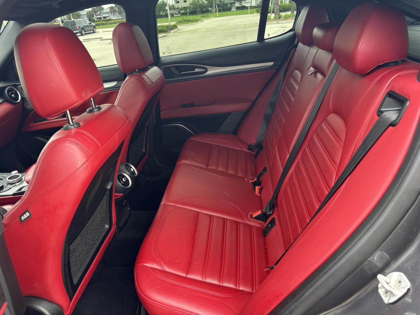 2018 GRAY /red Alfa Romeo Stelvio Ti Sport (ZASFAKNNXJ7) with an 2.0L L4 DOHC 16V engine, 8A transmission, located at 11170 Summerlin Square Dr., Fort Myers Beach, FL, 33931, (239) 999-7777, 26.493546, -81.941628 - We have financing available and we accept trades! Fill out a credit application on our website or come by today! If you have any questions, give us a call at (239) 999 - 7777 or visit our website at firstautocredit.com. 11170 Summerlin Square Dr, Fort Myers Beach, FL 33931 Carfax No Acciden - Photo#12