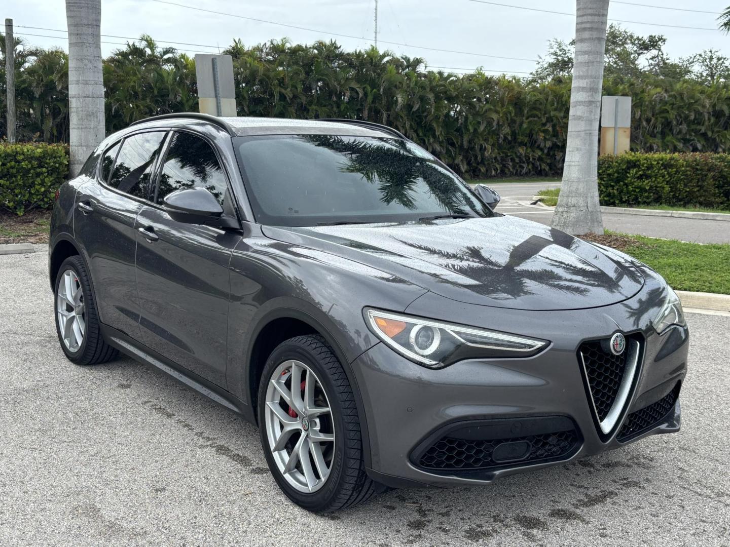 2018 GRAY /red Alfa Romeo Stelvio Ti Sport (ZASFAKNNXJ7) with an 2.0L L4 DOHC 16V engine, 8A transmission, located at 11170 Summerlin Square Dr., Fort Myers Beach, FL, 33931, (239) 999-7777, 26.493546, -81.941628 - We have financing available and we accept trades! Fill out a credit application on our website or come by today! If you have any questions, give us a call at (239) 999 - 7777 or visit our website at firstautocredit.com. 11170 Summerlin Square Dr, Fort Myers Beach, FL 33931 Carfax No Acciden - Photo#2
