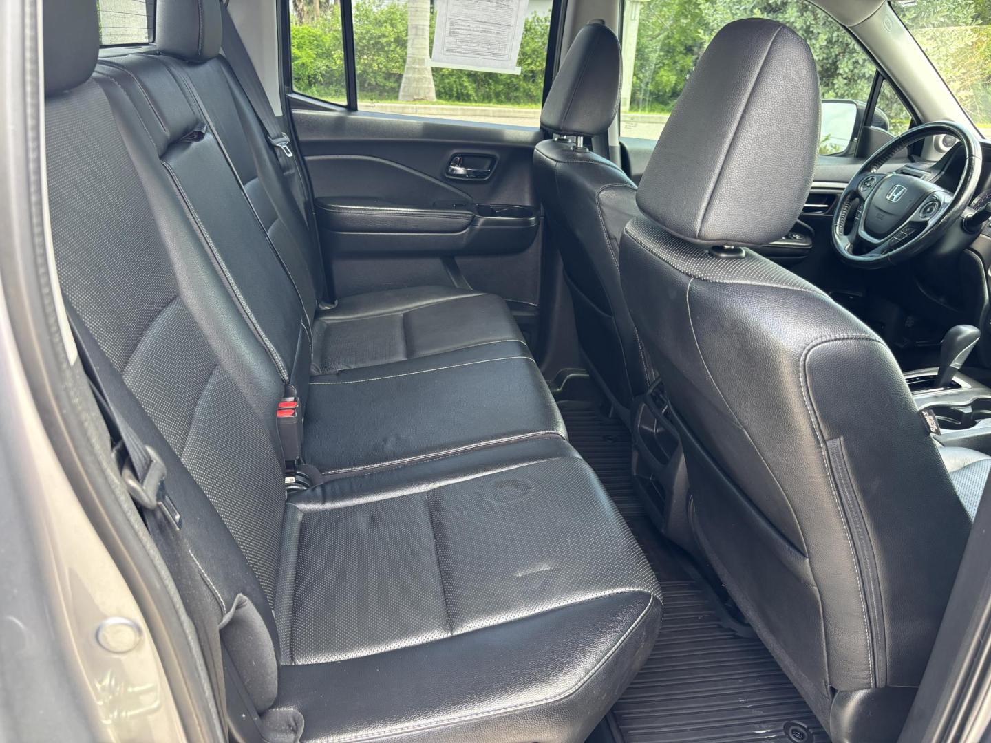 2018 GRAY /BLACK Honda Ridgeline RTL (5FPYK2F58JB) with an 3.5L V6 SOHC 24V engine, 6A transmission, located at 11170 Summerlin Square Dr., Fort Myers Beach, FL, 33931, (239) 999-7777, 26.493546, -81.941628 - We have financing available and we accept trades! Fill out a credit application on our website or come by today! If you have any questions, give us a call at (239) 999 - 7777 or visit our website at firstautocredit.com. 11170 Summerlin Square Dr, Fort Myers Beach, FL 33931 - Photo#17