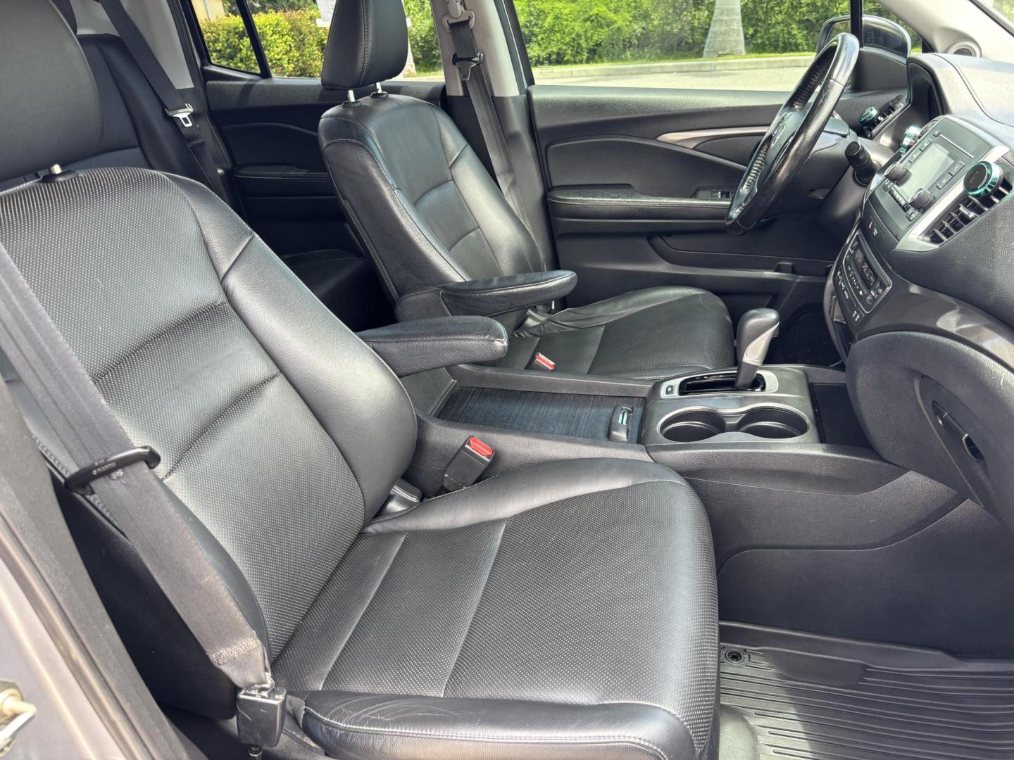 2018 GRAY /BLACK Honda Ridgeline RTL (5FPYK2F58JB) with an 3.5L V6 SOHC 24V engine, 6A transmission, located at 11170 Summerlin Square Dr., Fort Myers Beach, FL, 33931, (239) 999-7777, 26.493546, -81.941628 - We have financing available and we accept trades! Fill out a credit application on our website or come by today! If you have any questions, give us a call at (239) 999 - 7777 or visit our website at firstautocredit.com. 11170 Summerlin Square Dr, Fort Myers Beach, FL 33931 - Photo#16