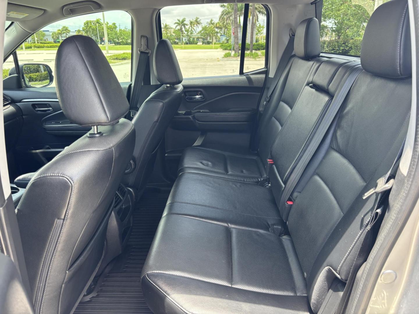 2018 GRAY /BLACK Honda Ridgeline RTL (5FPYK2F58JB) with an 3.5L V6 SOHC 24V engine, 6A transmission, located at 11170 Summerlin Square Dr., Fort Myers Beach, FL, 33931, (239) 999-7777, 26.493546, -81.941628 - We have financing available and we accept trades! Fill out a credit application on our website or come by today! If you have any questions, give us a call at (239) 999 - 7777 or visit our website at firstautocredit.com. 11170 Summerlin Square Dr, Fort Myers Beach, FL 33931 - Photo#20