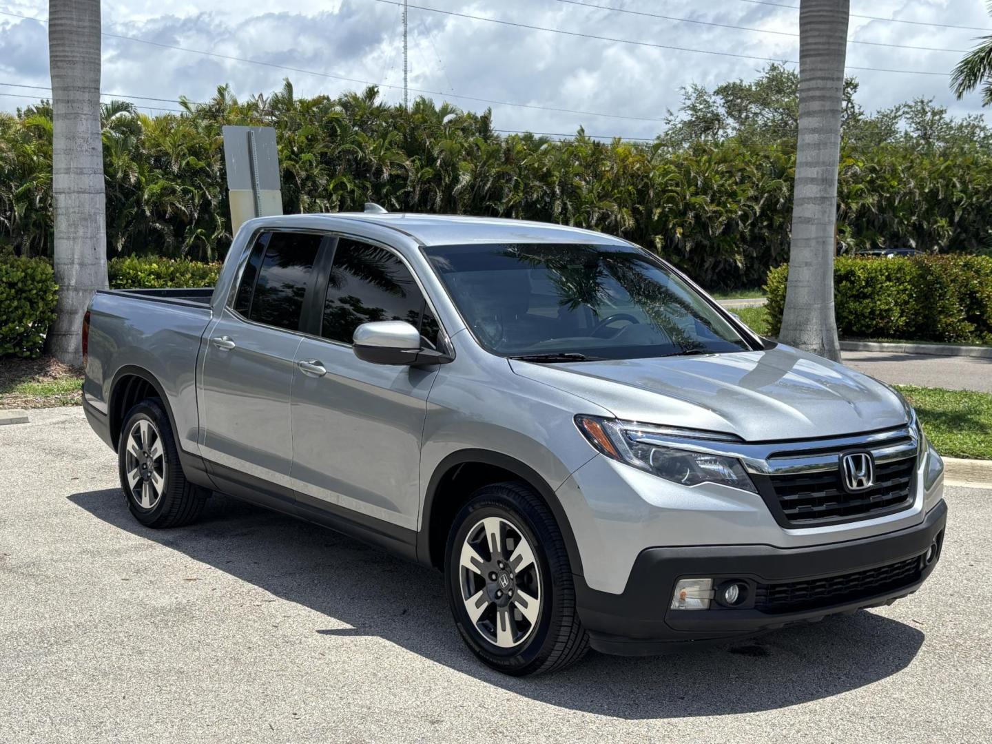2018 GRAY /BLACK Honda Ridgeline RTL (5FPYK2F58JB) with an 3.5L V6 SOHC 24V engine, 6A transmission, located at 11170 Summerlin Square Dr., Fort Myers Beach, FL, 33931, (239) 999-7777, 26.493546, -81.941628 - We have financing available and we accept trades! Fill out a credit application on our website or come by today! If you have any questions, give us a call at (239) 999 - 7777 or visit our website at firstautocredit.com. 11170 Summerlin Square Dr, Fort Myers Beach, FL 33931 - Photo#2