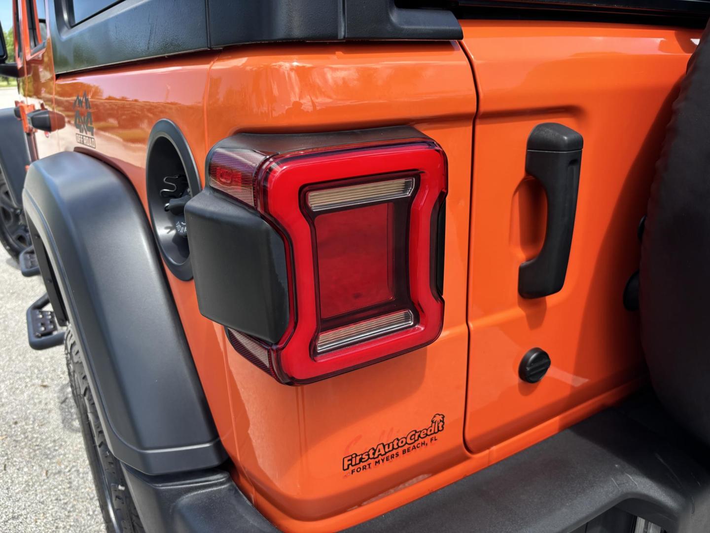 2018 ORANGE /charcoal Jeep Wrangler Unlimited Sport (1C4HJXDN1JW) with an 2.0L L4 DOHC 16V TURBO engine, 6A transmission, located at 11170 Summerlin Square Dr., Fort Myers Beach, FL, 33931, (239) 999-7777, 26.493546, -81.941628 - We have financing available and we accept trades! Fill out a credit application on our website or come by today! If you have any questions, give us a call at (239) 999 - 7777 or visit our website at firstautocredit.com. 11170 Summerlin Square Dr, Fort Myers Beach, FL 33931 No Damage No Acci - Photo#64