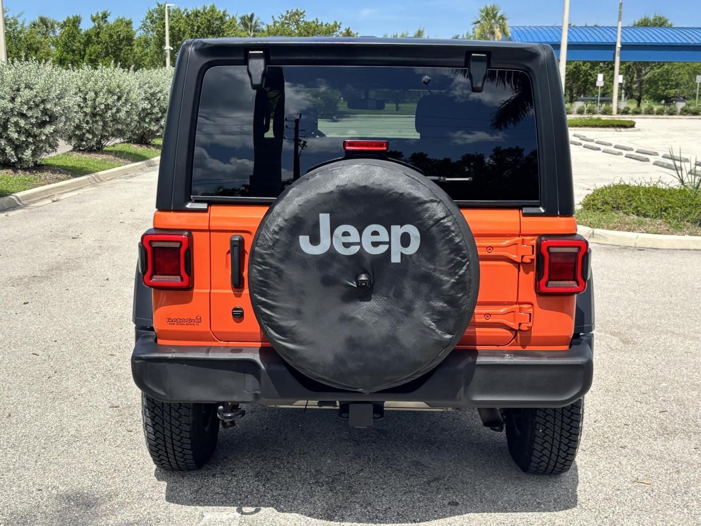 2018 ORANGE /charcoal Jeep Wrangler Unlimited Sport (1C4HJXDN1JW) with an 2.0L L4 DOHC 16V TURBO engine, 6A transmission, located at 11170 Summerlin Square Dr., Fort Myers Beach, FL, 33931, (239) 999-7777, 26.493546, -81.941628 - We have financing available and we accept trades! Fill out a credit application on our website or come by today! If you have any questions, give us a call at (239) 999 - 7777 or visit our website at firstautocredit.com. 11170 Summerlin Square Dr, Fort Myers Beach, FL 33931 No Damage No Acci - Photo#5