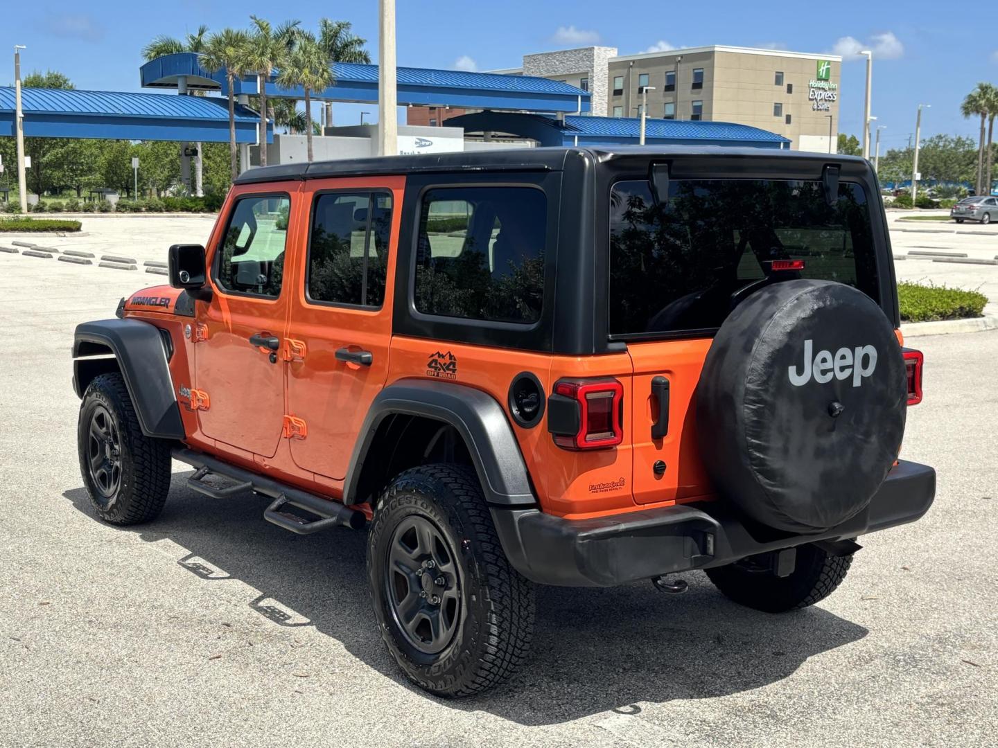 2018 ORANGE /charcoal Jeep Wrangler Unlimited Sport (1C4HJXDN1JW) with an 2.0L L4 DOHC 16V TURBO engine, 6A transmission, located at 11170 Summerlin Square Dr., Fort Myers Beach, FL, 33931, (239) 999-7777, 26.493546, -81.941628 - We have financing available and we accept trades! Fill out a credit application on our website or come by today! If you have any questions, give us a call at (239) 999 - 7777 or visit our website at firstautocredit.com. 11170 Summerlin Square Dr, Fort Myers Beach, FL 33931 No Damage No Acci - Photo#4