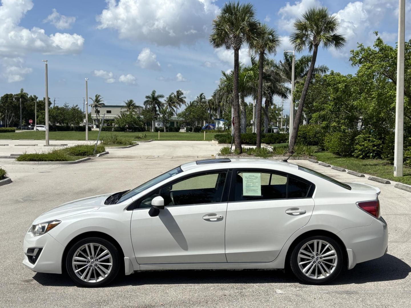 2015 WHITE Subaru Impreza 2.0i Premium PZEV 4-Door (JF1GJAK61FH) with an 2.0L H4 DOHC 16V engine, Continuously Variable Transmission transmission, located at 11170 Summerlin Square Dr., Fort Myers Beach, FL, 33931, (239) 999-7777, 26.493546, -81.941628 - Photo#4