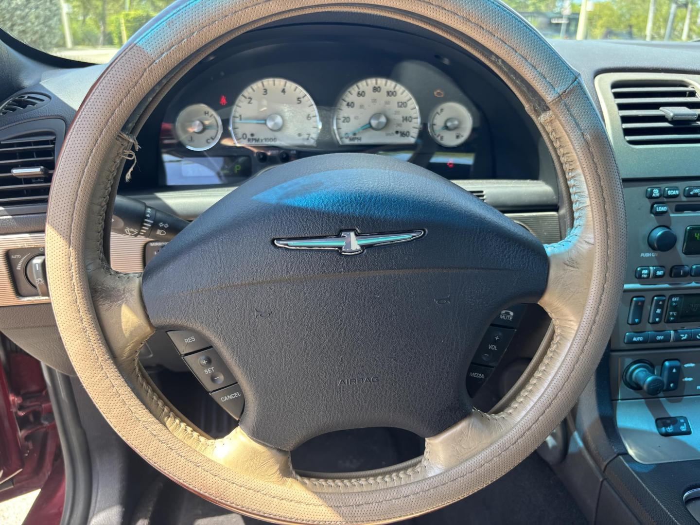 2004 MAROON /BEIGE LEATHER Ford Thunderbird Deluxe (1FAHP60A04Y) with an 3.9L V8 DOHC 32V engine, 5-Speed Automatic Overdrive transmission, located at 11170 Summerlin Square Dr., Fort Myers Beach, FL, 33931, (239) 999-7777, 26.493546, -81.941628 - Photo#39