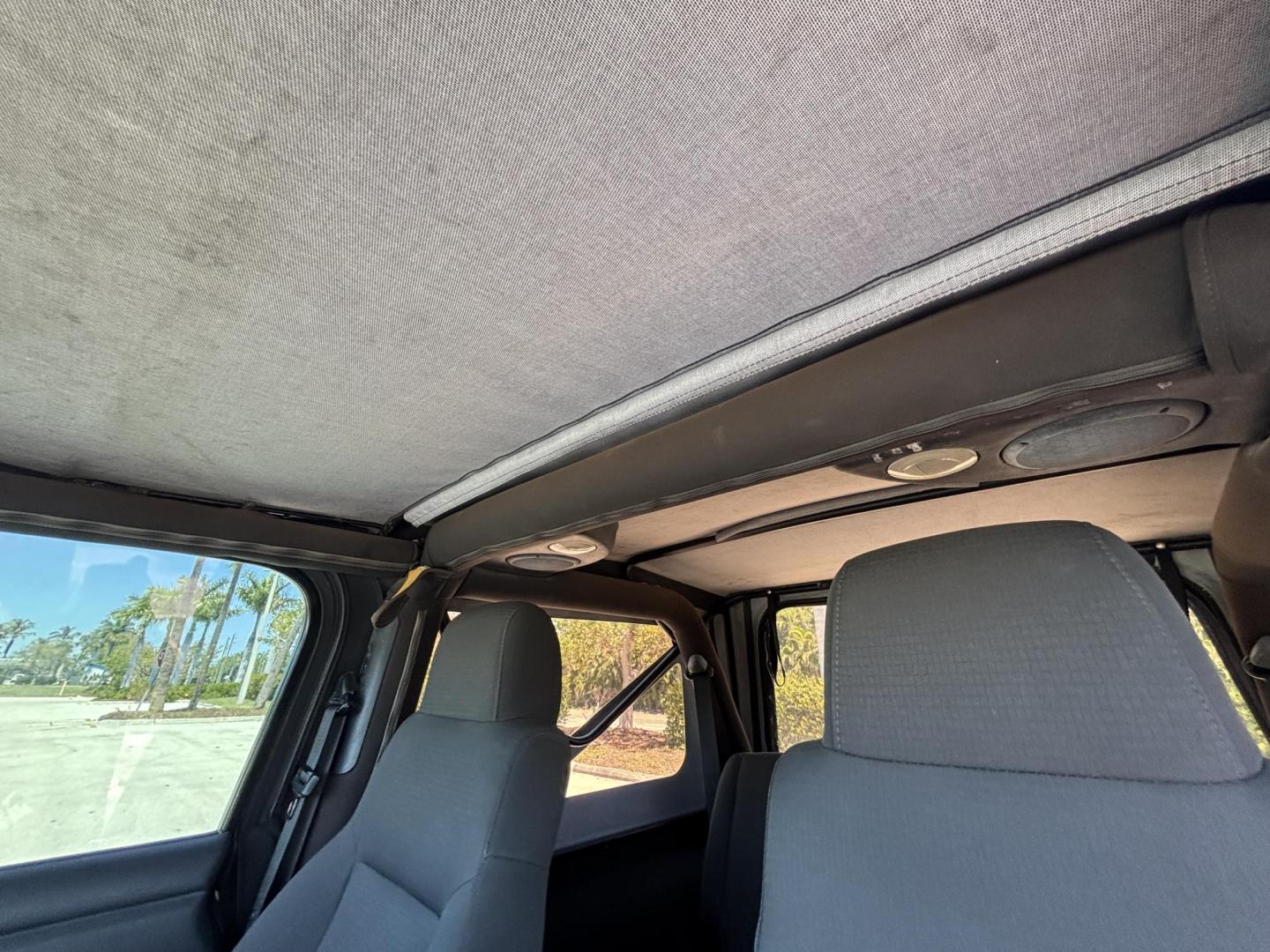 2006 BLACK /CHARCOAL CLOTH Jeep Wrangler Unlimited LJ (1J4FA44S86P) with an 4.0L L6 OHV 12V engine, Automatic transmission, located at 11170 Summerlin Square Dr., Fort Myers Beach, FL, 33931, (239) 999-7777, 26.493546, -81.941628 - Take a look at this iconic 2006 Jeep Wrangler — built for adventure and ready for the Florida lifestyle. This Wrangler delivers the classic Jeep experience with its rugged design, removable top, and go-anywhere capability. Whether you're cruising Fort Myers Beach with the top down or heading of - Photo#19