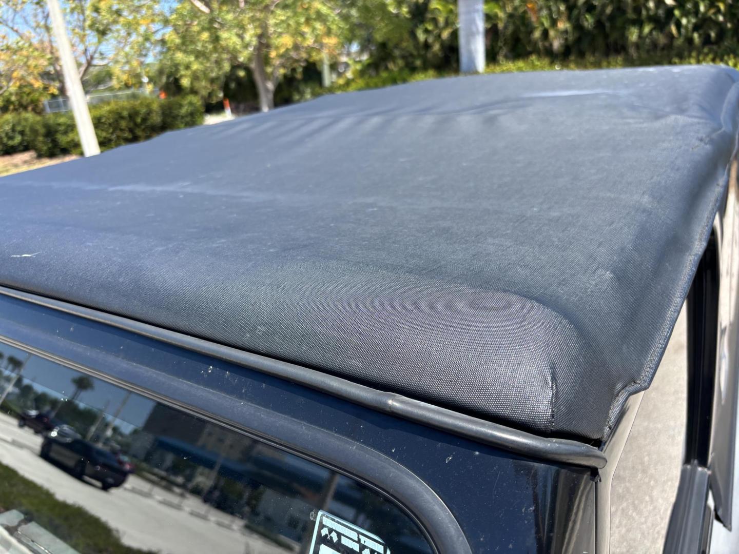 2006 BLACK /CHARCOAL CLOTH Jeep Wrangler Unlimited LJ (1J4FA44S86P) with an 4.0L L6 OHV 12V engine, Automatic transmission, located at 11170 Summerlin Square Dr., Fort Myers Beach, FL, 33931, (239) 999-7777, 26.493546, -81.941628 - Take a look at this iconic 2006 Jeep Wrangler — built for adventure and ready for the Florida lifestyle. This Wrangler delivers the classic Jeep experience with its rugged design, removable top, and go-anywhere capability. Whether you're cruising Fort Myers Beach with the top down or heading of - Photo#27